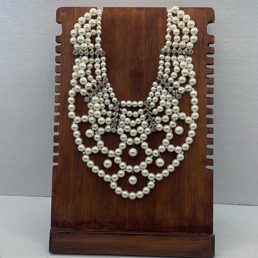 Dramatic white pearl collar with rhinestone accents